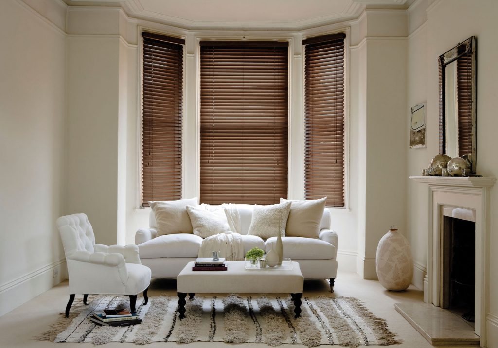 faux wood blinds in bay window